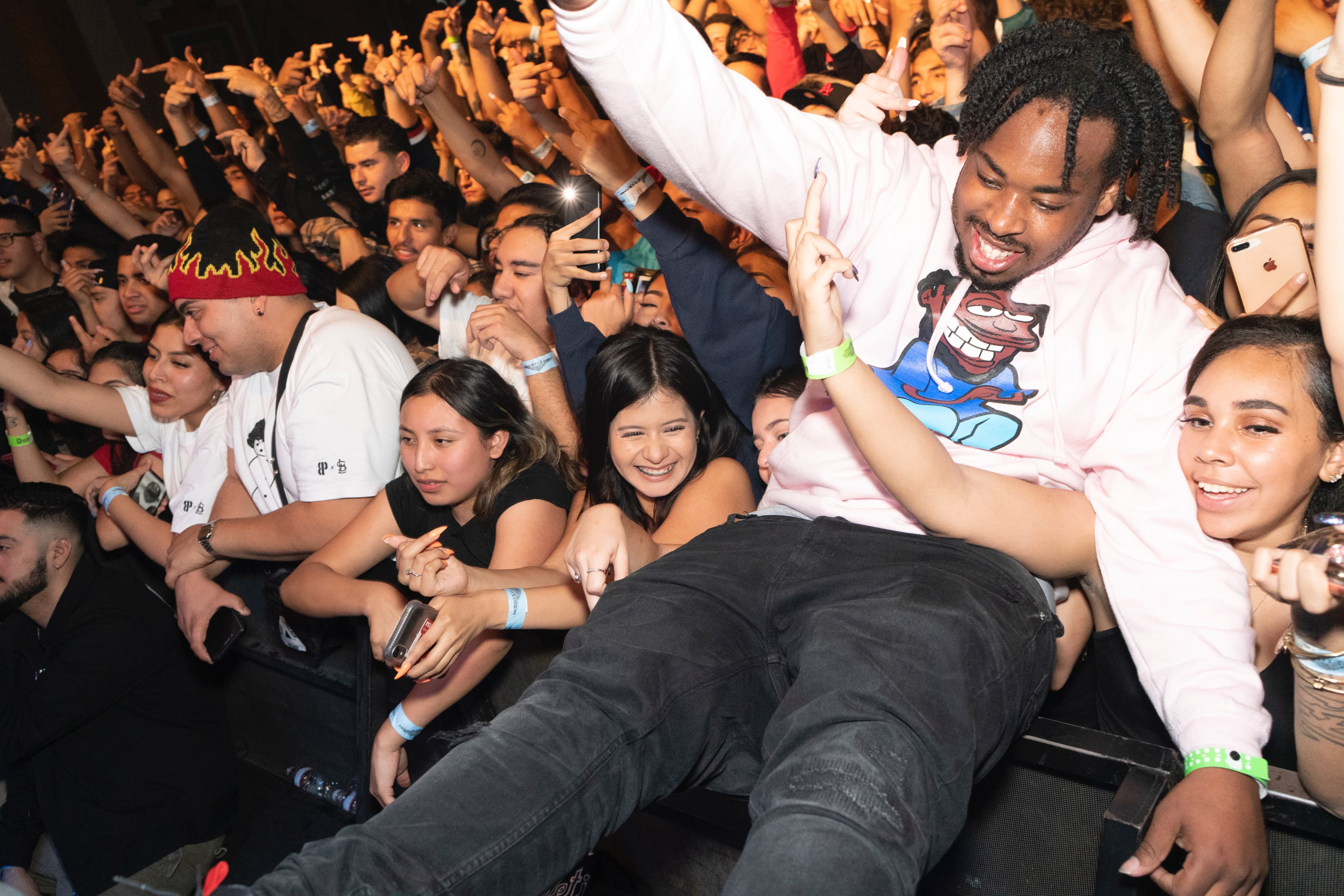 1TakeQuan crowd-surfing above fans
