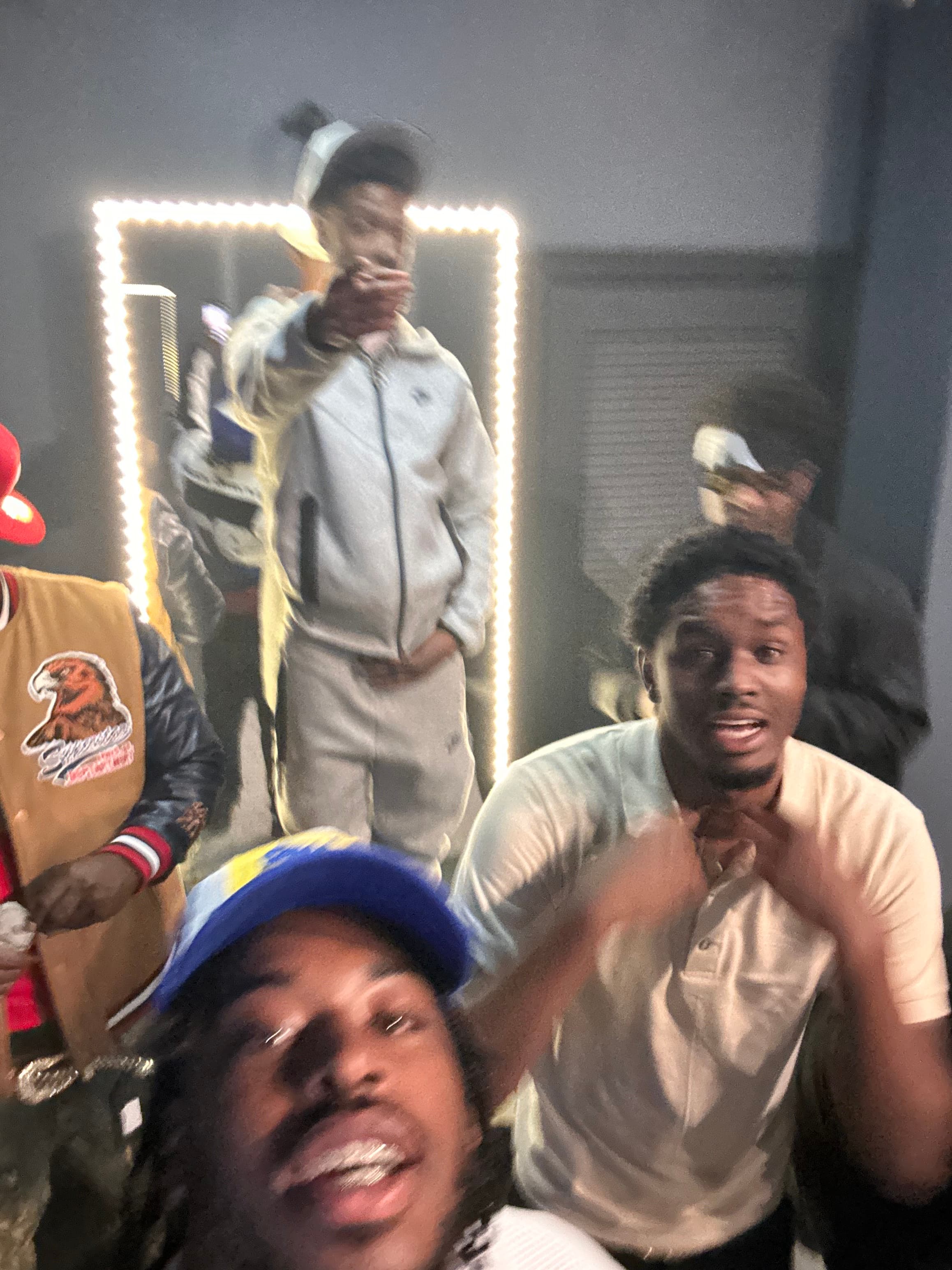 Crew selfie in an LED-lit room
